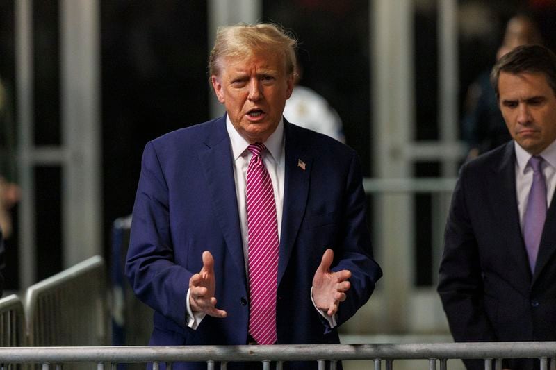 Republican presidential candidate, former President Donald Trump speaks to the media with his lawyer Todd Blanche, right, after court at Manhattan Criminal Court in New York, Friday, April 19, 2024. (Sarah Yenesel/Pool Photo via AP)
