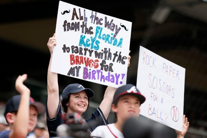 Some fans show their support for the Braves before the game against the Astros on Sunday at Truist Park. (Miguel Martinez / miguel.martinezjimenez@ajc.com)