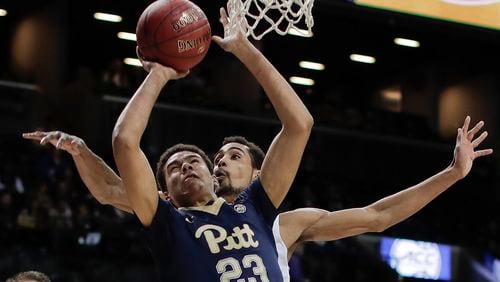 Pittsburgh guard Cameron Johnson (23) puts up a shot against Georgia Tech forward Quinton Stephens (12) during the first half of a first-round ACC tournament game on Tuesday, March 7, 2017, in New York. (AP Photo/Julie Jacobson)