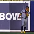 Atlanta Braves right fielder Ronald Acuna Jr. catches a ball hit by Miami Marlins' Vidal Brujan during the fifth inning of a baseball game, Saturday, April 13, 2024, in Miami. (AP Photo/Wilfredo Lee)