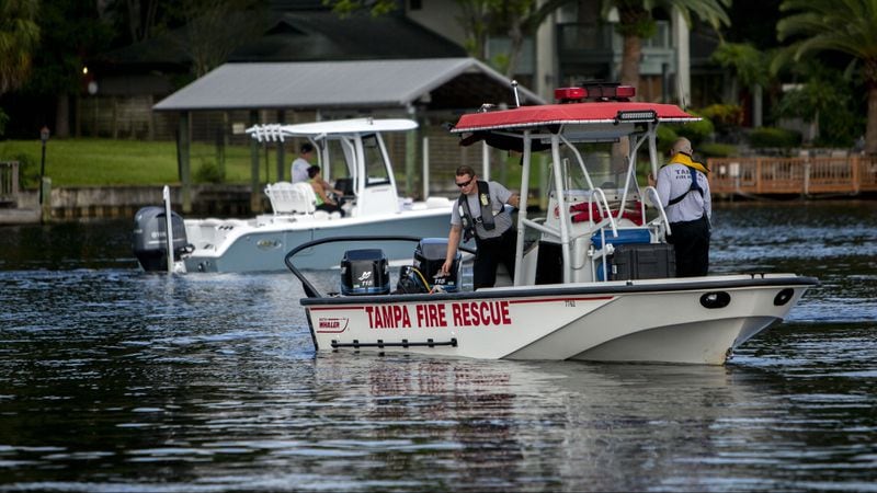 Tampa Fire Rescue personnel are seen on the Hillsborough River where Je'Hyrah Daniels, 4, was pulled from the water Thursday, Aug. 2, 2018. The girl's mother, Shakayla Denson, 26, is accused of carrying the screaming girl into the river and dumping her in the murky water before wading out again. The girl's body was found by divers about 30 minutes later.