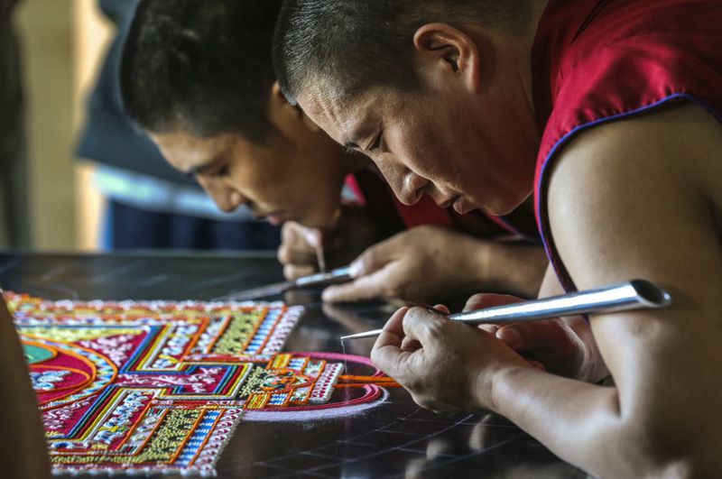 Tibetan monks, Lobsang Tsering (left) and Dorjee (right) continued Mandala Sand Painting on Thursday, March 23, 2017 at the Michael C. Carlos Museum as Emory University observes Tibet Week. 