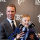 Former Falcons quarterback Matt Ryan brings his son to the microphone after announcing his retirement at a press conference at the Falcons practice facility in Flowery Branch on Monday, April 22, 2024. (Arvin Temkar / arvin.temkar@ajc.com)