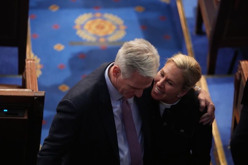 U.S. Reps. Kevin McCarthy (R-Calif.) and Marjorie Taylor Greene (R-Ga.) confer as voting for a new Speaker of the House continued in Washington on Friday, Jan. 6, 2023. Greene, who recently said that if she had lead the attack on the U.S. Capitol on Jan. 6, 2021, "we would have won,” has been given a seat on the House Oversight Committee. (Haiyun Jiang/The New York Times)