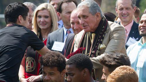 Atlanta United Owner and Chairman Arthur Blank shakes hands with one of the Atlanta United soccer players after the ground breaking ceremony of the Children’s Healthcare of Atlanta Training Ground in Marietta GA Tuesday 11, 2017. STEVE SCHAEFER / SPECIAL TO THE AJC