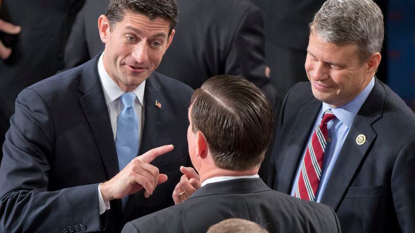 FILE -- U.S. Rep. Paul Ryan, left, shares some thoughts with his colleagues. (Ron Sachs/DPA/Zuma Press/TNS)