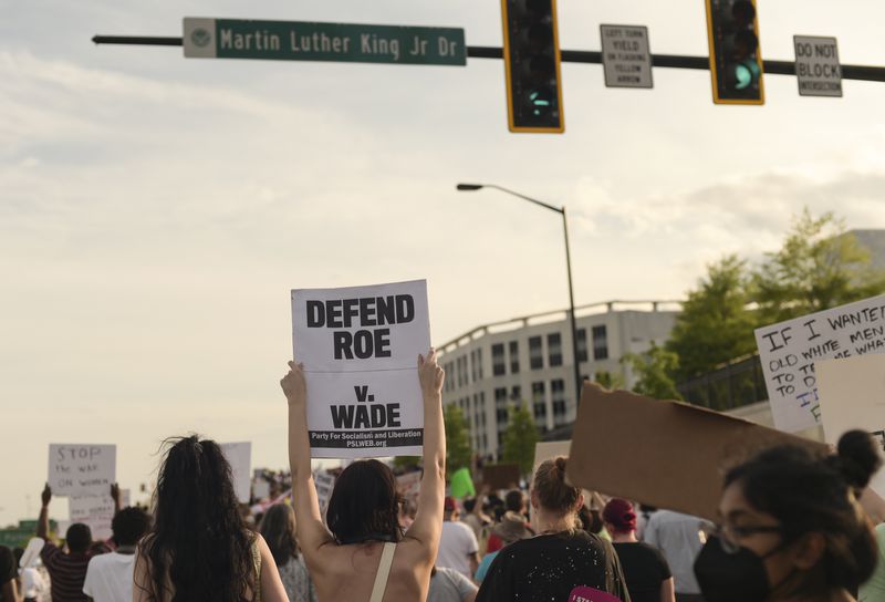 Hundreds of demonstrators march to The Capitol on Tuesday, May 3, 2022  to protest the Supreme Court’s leaked draft overturning Roe v. Wade.  (Natrice Miller / natrice.miller@ajc.com)