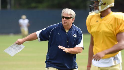 Defensive coordinator Ted Roof gives instructions to his defensive backs during Georgia Tech football practice. JOHNNY CRAWFORD / JCRAWFORD@AJC.COM