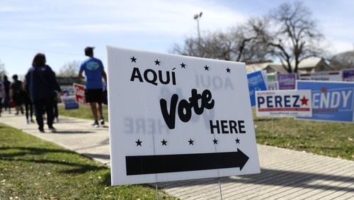 A sign shows voters where they can cast their ballots in San Antiono for Texas’ presidential primary. Texas is one of the top prizes in Super Tuesday’s voting, trailing only California in the number of delegates up for grabs in the race for the Democratic nomination. (AP Photo/Eric Gay)