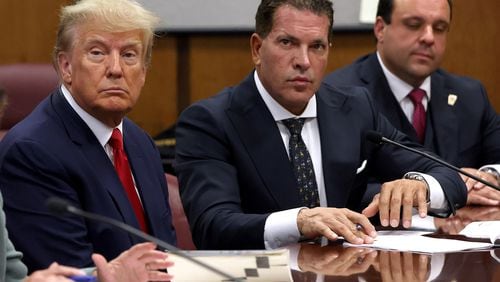 Donald Trump, left, will face charges of falsifying business records Monday in a New York City courtroom. It will be the first-ever criminal trial of a former president. (Andrew Kelly/Pool/Getty Images/TNS)