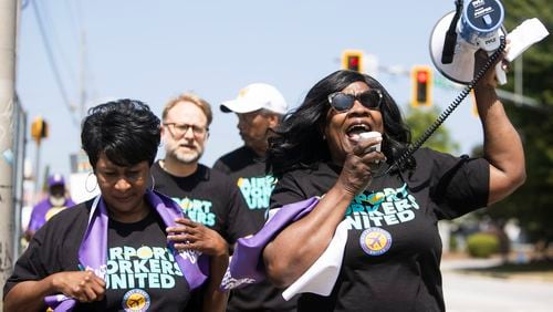 Lora Porter leads protesters in chants during the Airport Workers United march to Delta Headquarters on Saturday, June 3, 2023, in Atlanta. Over 200 protesters marched to demand higher wages. CHRISTINA MATACOTTA FOR THE ATLANTA JOURNAL-CONSTITUTION 