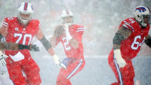 Buffalo quarterback Nathan Peterman tries to throw a pass during the second quarter Sunday. Snowy conditions made visibility difficult during the game.