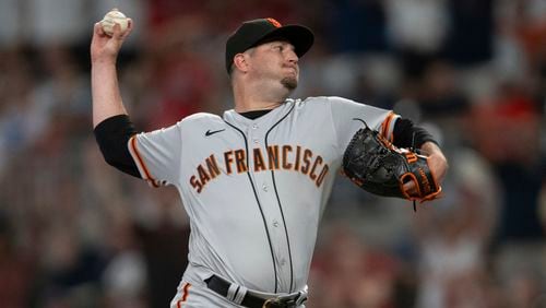 San Francisco Giants relief pitcher Luke Jackson throws to an Atlanta Braves batter during seventh inning of a baseball game Friday, Aug. 18, 2023, in Atlanta. (AP Photo/Hakim Wright Sr.)