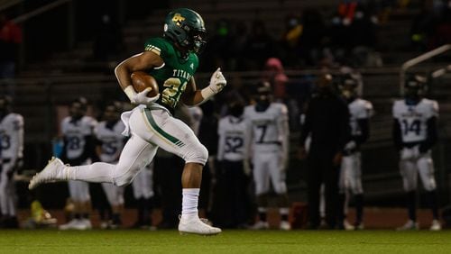 Justice Haynes (22) sophomore running back for Blessed Trinity, sprints to the end zone against Decatur High School during the second-round playoff game Friday, Dec. 4, 2020, in Roswell. Blessed Trinity won 44-0. (Christina Matacotta/For the AJC)