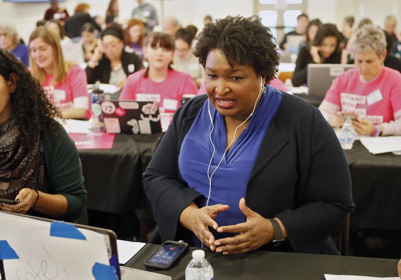 November 21, 2019 - Atlanta - Stacey Abrams makes some calls at the phone bank.  Democratic presidential candidates including Cory Booker, Amy Klobuchar, Andrew Yang and Pete Buttigieg, along with Stacey Abrahms,  were calling and texting voters Thursday whose registrations could be canceled in Georgia at a Fair Fight phone bank at Ebenezer Baptist Church in Atlanta. The phone bank was in response to Georgia election officials' plan to cancel more than 313,000 voter registrations next month.   Bob Andres / robert.andres@ajc.com