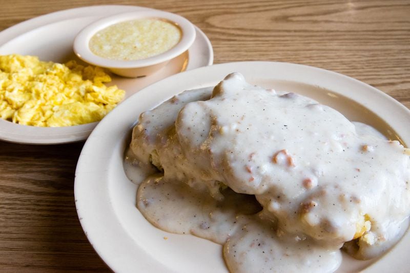 Country-fried steak at Old Hickory House is served on top of a split biscuit and hidden under a blanket of gravy. CONTRIBUTED BY HENRI HOLLIS