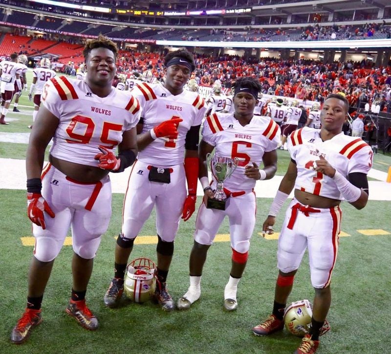 The Griffin brothers celebrate the 2016 Class AAAAA state championship over Buford at the Georgia Dome. From left to right: Ja'Quon, Jaylen, Jamious and Ja'Kolbi. (Photo courtesy Tyrone Griffin)