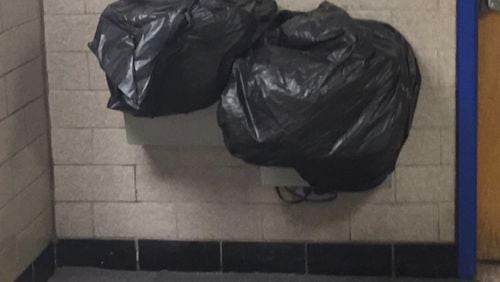 A reader-submission from an elementary school in DeKalb County shows plastic bags covering water fountains. The district is under a boil-water advisory and schools are restricting use of water from faucets and fountains.