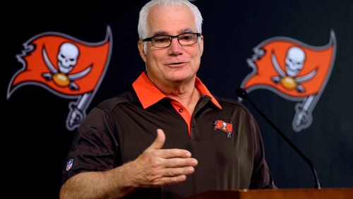 Former Falcons coach Mike Smith, the new defensive coordinator for the Tampa Bay Buccaneers, gestures during a news conference Wednesday in Tampa. (AP photo)