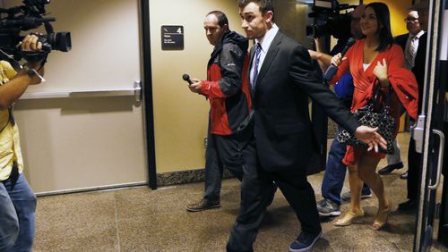 Heisman Trophy-winning quarterback Johnny Manziel leaves the Frank Crowley Courts Building, Thursday, Nov. 17, 2016, in Dallas. Manziel has reached a deal with prosecutors for the conditional dismissal of a domestic assault case involving his former girlfriend. Defense attorney Jim Darnell said there was still work to be done to finalize the deal, but said after the hearing that he was encouraged. A judge set another hearing for Dec. 1, when the case could be settled. (David Woo/The Dallas Morning News via AP)