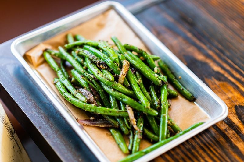 Sweet Auburn’s Wok-Fired Green Beans, which are on the menu at the Poncey-Highland location, are a side dish with an Asian touch. CONTRIBUTED BY HENRI HOLLIS