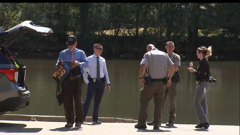 Emergency responders pulled an unidentified man's body from 59-degree water near a park in Roswell.