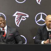 Falcons coach Raheem Morris and general manager Terry Fontenot share a laugh while responding to a question Monday, Monday, Feb. 5, 2024, during Morris' introductory press conference. (Jason Getz/The Atlanta Journal-Constitution/TNS)