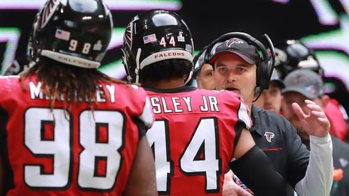 Atlanta Falcons head coach Dan Quinn encourages Vic Beasley Jr. and Takk McKinley as they come off the field after the Los Angeles Rams scored a touchdown following a Matt Ryan interception during the second half Sunday, Oct. 20, 2019, in Atlanta.