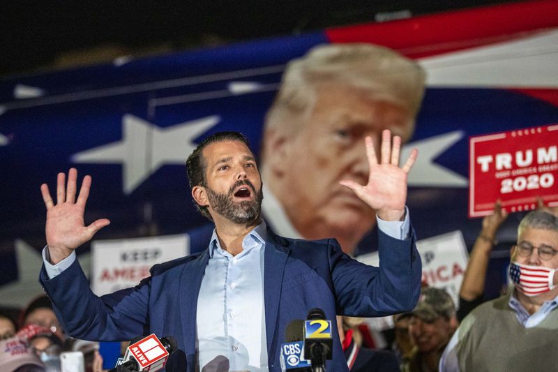 11/05/2020 —  Atlanta, Georgia — Donald Trump Jr. makes remarks during a rally in the parking lot at the Georgia Republican Party Headquarters in Atlanta’s Buckhead community, Thursday, November 5, 2020. Trump Jr. spoke a little while after his father, President Donald Trump, made remarks at the White House in Washington, D.C. (Alyssa Pointer / Alyssa.Pointer@ajc.com)