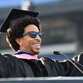 Rapper and actor Chris “Ludacris” Bridges holds up his honorary bachelor’s degree during a commencement ceremony at Center Parc Stadium on Wednesday, May 4, 2022. (Hyosub Shin / Hyosub.Shin@ajc.com)