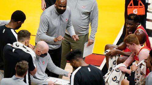 awks interim coach Nate McMillan, center, gestures as he talks to players during a timeout in the first half of the team's NBA basketball game against the Miami Heat, Tuesday, March 2, 2021, in Miami. (AP Photo/Wilfredo Lee)