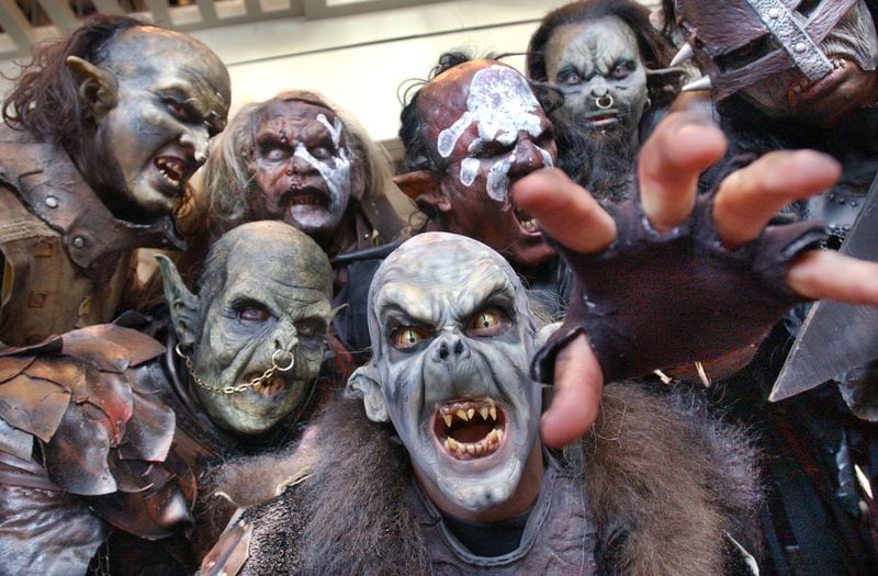 Orcs and Uruk-Hai characters from the 'Lord of the Rings' movies could be found wandering the halls on the opening day of Dragon Con, the sci-fi convention held at the Hyatt Regency. This group consisted of costumers, actors, and make-up artists from Orlando and New York. Front and center is Brian Wolfe (cq), Orlando, who works in the Universal Studios prosthetics department.