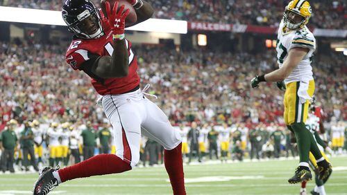 *** POSSIBLE VISUAL LEDE *** October 30, 2016 ATLANTA: — GAME WINNER — Falcons wide receiver Mohamed Sanu catches a touchdown pass from Matt Ryan past Packers defender Jake Ryan for a 33-32 victory in an NFL football game on Sunday, Oct. 30, 2016, in Atlanta. Curtis Compton /ccompton@ajc.com