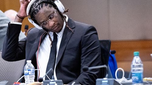 Atlanta rapper Young Thug, whose real name is Jeffery Williams, waits for the start of opening statements of his trial at Fulton County Courthouse Monday, Nov. 27, 2023.   (Steve Schaefer/steve.schaefer@ajc.com)