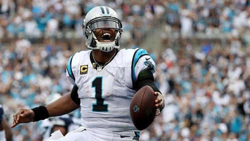 Panthers quarterback Cam Newton celebrates a touchdown against the Dallas Cowboys Sept.  9, 2018, at Bank of America Stadium  in Charlotte, N.C.