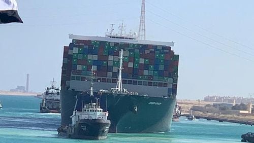 The Ever Given makes its way through the Suez Canal in Egypt after being freed Monday. The mammoth cargo ship blocking one of the world’s most vital maritime arteries was wrenched from the shoreline and finally set free Monday. (Suez Canal Authority via The New York Times)