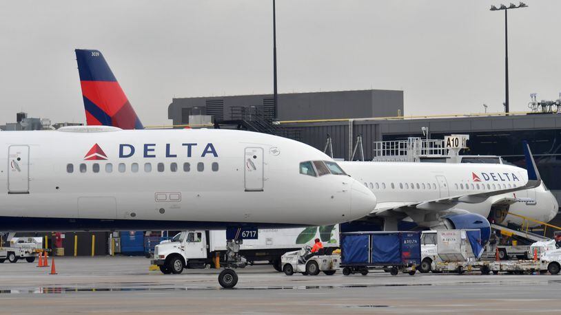 Delta planes at domestic gates at Hartsfield-Jackson International Airport.