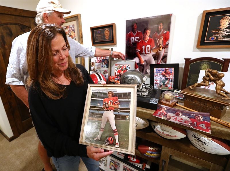 Steve Bartkowski, here with wife Sandee, has buried most of the relics of his Falcons career in the basement of his home in Montana. (Curtis Compton/ccompton@ajc.com)