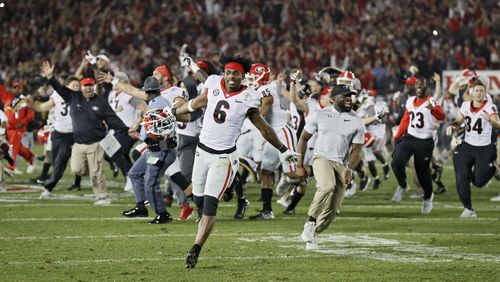 Georgia players celebrate after scoring a touchdown during the second overtime period of  the College Football Playoff Semifinal at the Rose Bowl Game on Monday, January 1, 2018, in Pasadena.  Georgia won 54-48.   BOB ANDRES  /BANDRES@AJC.COM