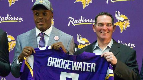 Teddy Bridgewater and Mike Zimmer on draft day. (Associated Press)