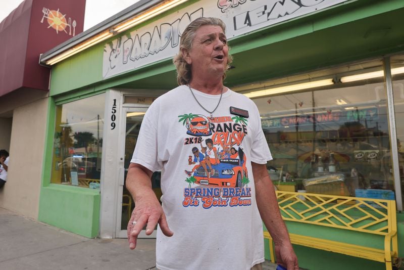 Mark Ballance, owner of Paradise Snowcones and Fresh Squeezed Lemonade in Tybee Island, wears an Orange Crush shirt from 2018 on Saturday, April 20, 2024. (Natrice Miller/ AJC)