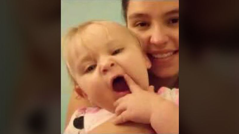 This undated photo provided by the Albuquerque Police Department shows 1-year-old Anastazia Zuber and her mother, 23-year-old Monique Romero. Authorities asked for help finding Anastazia and her family after police said her father told family in mid-December the infant had drowned in a bathtub. The baby was found buried Jan. 4, 2019, in the backyard of a landscaping client of the girl’s father, David Zuber Jr.