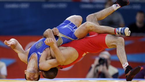 2012 Olympic highlights showing Revaz Lashkhi of the country of Georgia  as he wraps up Zaur Kuramagomedov of Russia (in blue) during the 60-kg Greco-Roman wrestling competition. The USA Wrestling team will hold a training camp at The Cooler athletic center in Alpharetta in May. The team is preparing to compete in the Tokyo Summer Olympics which starts July 23.