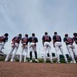 Atlanta Braves players line up for the national anthem before a spring training baseball game against the Detroit Tigers in North Port, Fla., Tuesday, March 5, 2024. (AP Photo/Gerald Herbert)
