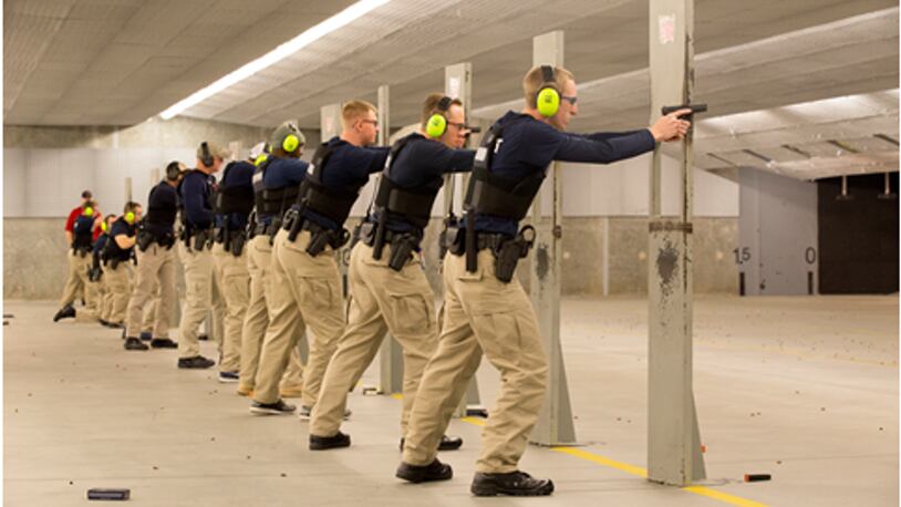 Gwinnett County Police Department recruits train with firearms.