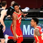 The Atlanta Hawks' De'Andre Hunter (12) reacts during the second half against the Brooklyn Nets at Barclays Center in New York on Friday, Jan. 1, 2021. The Hawks won, 114-96. (Sarah Stier/Getty Images/TNS)