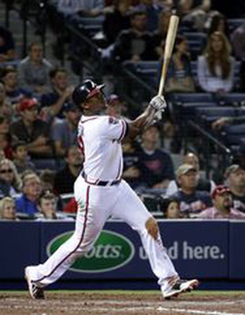 Justin Upton follows through on his game-tying homer off Tyler Clippard on Friday.