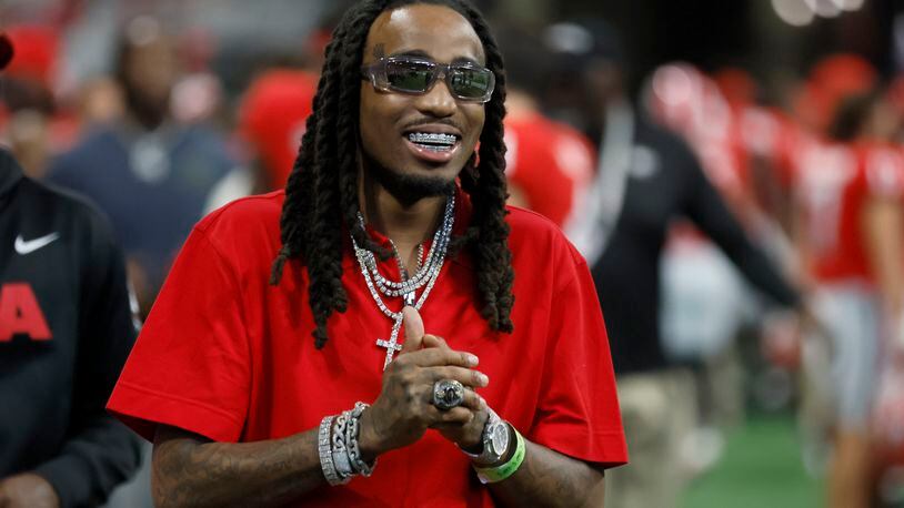 Quavo celebrates on the Georgia Bulldogs bench in the closing minutes of Georgia’s 49-3 win against the Oregon Ducks in the Chick-fil-A Kickoff game at Mercedes-Benz Stadium, Saturday, Sept. 3, 2022, in Atlanta. (Jason Getz / AJC file photo)