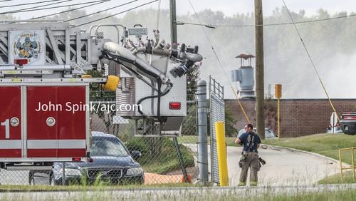 Fire crews remain on the scene of a chemical reaction that occurred early Monday morning at a warehouse in Conyers.