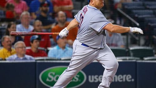 Bartolo Colon, here hitting an RBI single for the New York Mets against the Braves last season, has gotten as much attention for his physique as his pitching. (Curtis Compton / ccompton@ajc.com)